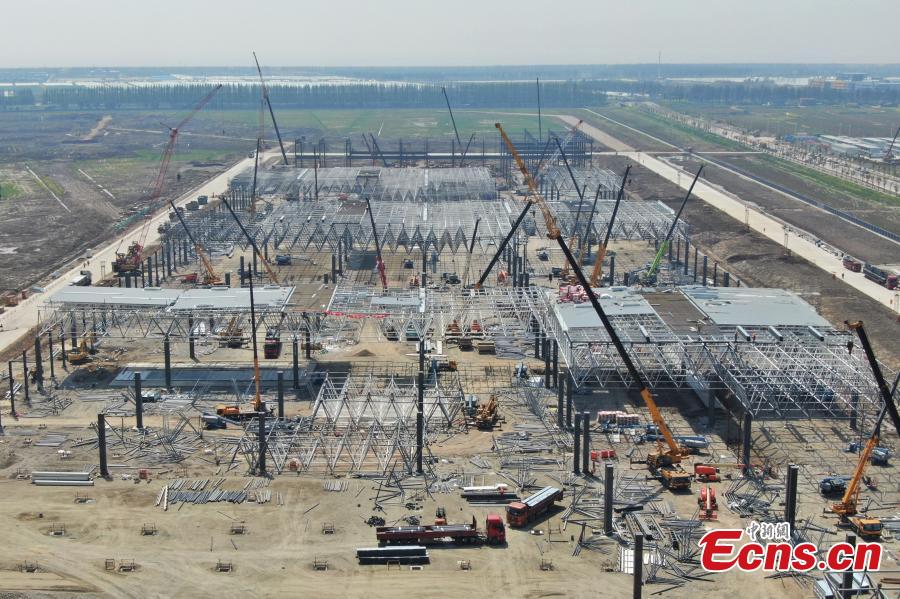 Construction of Tesla\'s Shanghai Gigafactory 3 is in full swing, April 8, 2019. Several sets of steel structural roof frames have been installed. The new plant, Tesla\'s first outside the United States, is located in Lingang Area, a high-end manufacturing park in the southeast harbor of Shanghai. It is designed to have an annual capacity to create 500,000 electric cars. (Photo: China News Service/Zhang Hengwei)