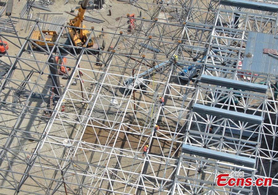 Construction of Tesla\'s Shanghai Gigafactory 3 is in full swing, April 8, 2019. Several sets of steel structural roof frames have been installed. The new plant, Tesla\'s first outside the United States, is located in Lingang Area, a high-end manufacturing park in the southeast harbor of Shanghai. It is designed to have an annual capacity to create 500,000 electric cars. (Photo: China News Service/Zhang Hengwei)