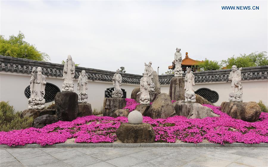 Photo taken on April 18, 2019 shows sculptures at the Encho-en garden in Tottori, Japan. Covering an area of about 10,000 square meters, Encho-en is one of the biggest full-scaled Chinese-style garden in Japan. It was built in 1995 to show the friendship between Tottori and north China\'s Hebei Province. The designing and materials procurement and processing took place in China. The main building was shop-assembled in China before the final assembly in Japan. All these steps were supervised by Chinese engineers. (Xinhua/Du Xiaoyi)