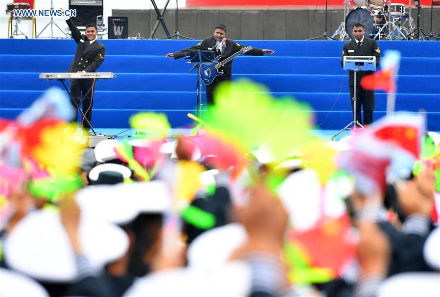 A military band from Bangladesh performs during a joint military music display held to celebrate the People\'s Liberation Army Navy\'s 70th founding anniversary in Qingdao, east China\'s Shandong Province, April 22, 2019. The military bands from the navies of China, Thailand, Vietnam, Bangladesh and India performed at the event. Over 1,200 people, including officers and soldiers of navy vessels from home and abroad and Qingdao citizens, viewed the performance. (Xinhua/Zhu Zheng)