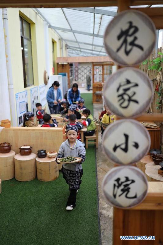Children help make festival cuisine to mark the upcoming \