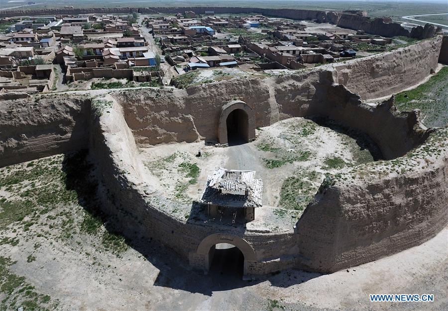 Aerial photo taken on May 28, 2019 shows the southern gate and barbican of the Yongtai ancient city in Jingtai County of Baiyin, northwest China\'s Gansu Province. Construction of the Yongtai ancient city began in the early 17th century and the complex used to be a military fortress. Girdled by 12-meter wall structures totaling 1.7 kilometers in length, the Yongtai ancient city looks like a turtle when seen from above and is thus dubbed \