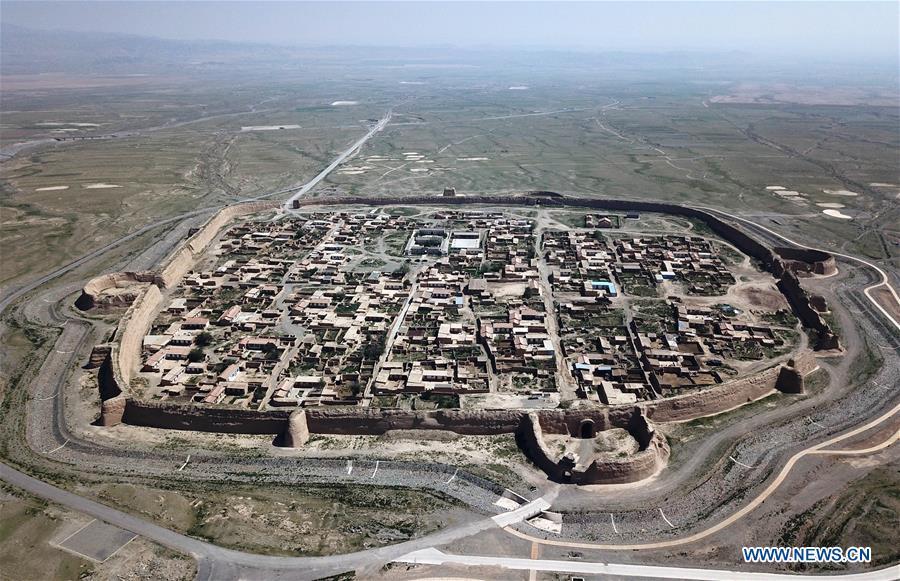 Aerial photo taken on May 28, 2019 shows a view of the Yongtai ancient city in Jingtai County of Baiyin, northwest China\'s Gansu Province. Construction of the Yongtai ancient city began in the early 17th century and the complex used to be a military fortress. Girdled by 12-meter wall structures totaling 1.7 kilometers in length, the Yongtai ancient city looks like a turtle when seen from above and is thus dubbed \