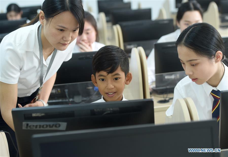 Thuch Salik attends a computer class at a foreign language school in Zhuji, east China\'s Zhejiang Province, May 29, 2019. Thuch Salik became viral overnight when a video clip showing him selling souvenirs in a dozen distinct languages near Angkor Wat was shared online on November 2018. Born in a family with financial difficulties, the 14-year-old Cambodian boy got global attention for his multilingual talent. In May, Salik was offered a place at a foreign language school in Zhuji of east China\'s Zhejiang Province on an education programme funded by a private sponsor in China. Salik said he has high expectations for his education opportunity and life in China. (Xinhua/Han Chuanhao)