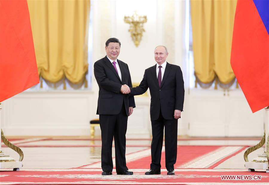 Chinese President Xi Jinping (L) shakes hands with his Russian counterpart Vladimir Putin while posing for photos ahead of their talks in Moscow, Russia, June 5, 2019. Xi Jinping held talks with Vladimir Putin at the Kremlin in Moscow on Wednesday. (Xinhua/Ding Haitao)