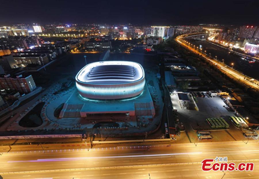 The illuminated gymnasium newly built at Hebei North University in Zhangjiakou City, North China’s Hebei Province. With a total investment of 261 million yuan ($37.8 million), the building has a floor area of 26,300 square meters and is the first dome structure gymnasium in Hebei. It can be used to host international and national competitions for many ice-based events, such as ice hockey, short-track speed skating and figure skating. (Photo: China News Service/Wu Diansen)