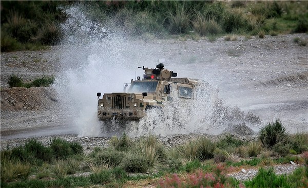 An armored vehicle takes part in a joint anti-terrorism drill conducted by Chinese and Kyrgyz border defense troops in Artux, Xinjiang Uygur autonomous region, on June 27, 2017. (Photo by Zhang Zheng/chinadaily.com.cn) An armored vehicle takes part in a joint anti-terrorism drill conducted by Chinese and Kyrgyz border defense troops in Artux, Xinjiang Uygur autonomous region, on June 27, 2017. (Photo by Zhang Zheng/chinadaily.com.cn)