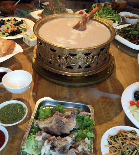 A bowl of Mongolian milk tea is the centerpiece of the lunch table. (Photo/Courtesy of Brian Salter) A bowl of Mongolian milk tea is the centerpiece of the lunch table. (Photo/Courtesy of Brian Salter)