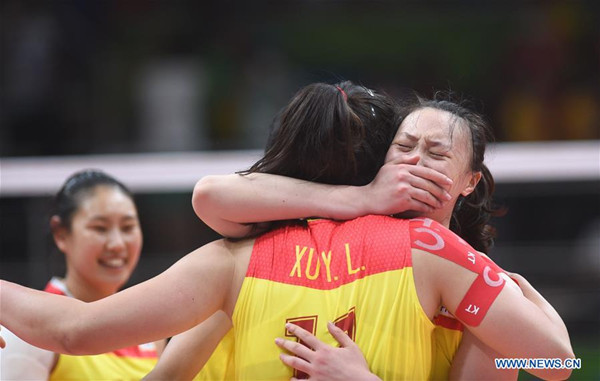 China's players celebrate after the women's gold medal match of Volleyball against Serbia at the 2016 Rio Olympic Games in Rio de Janeiro, Brazil, on Aug. 20, 2016. China won the gold medal. (Xinhua/Yue Yuewei) China's players celebrate after the women's gold medal match of Volleyball against Serbia at the 2016 Rio Olympic Games in Rio de Janeiro, Brazil, on Aug. 20, 2016. China won the gold medal. (Xinhua/Yue Yuewei)